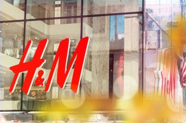NEW YORK, USA - MAY 15, 2019: close up shot of H M logo. H M Hennes Mauritz AB is a Swedish multinational retail-clothing company, known for its fashion clothing
