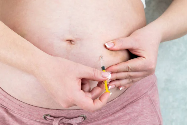 stock image Blood thinners concept. Pregnant woman making injection in her belly