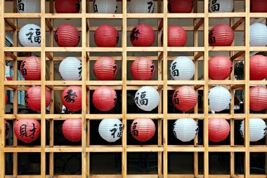 Chinese sky lanterns decorative wall. Words in English are Goods, Grace, Missis