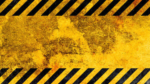 Grunge yellow and black diagonal stripes. Industrial warning background, warn caution, construction, safety