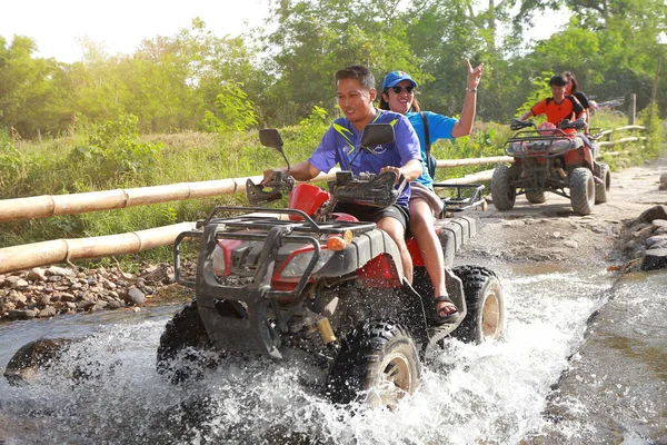 stock image NAKHONNAYOK, THAILAND - DECEMBER 19 : Tourists riding ATV to nature adventure on dirt track on DECEMBER 19, 2015, Thailand.