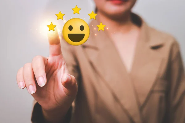 Stock image Customer pressing satisfaction with gold five star rating feedback icon and press level excellent rank for giving best score point to review the service , experience success business rate  concept.