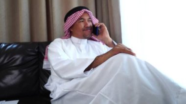 Happy middle eastern businessman working from home