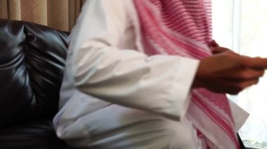 Happy middle eastern businessman working from home