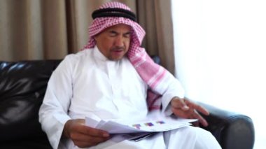 Happy middle eastern businessman working from home