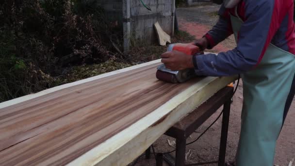 Male Carpenter Using Electric Woodworking Tool Work Outdoors — Vídeos de Stock