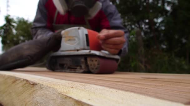Male Carpenter Using Electric Woodworking Tool Work Outdoors — Wideo stockowe
