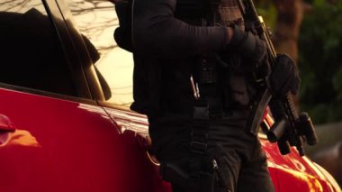 close-up footage of police officer in uniform near vehicle