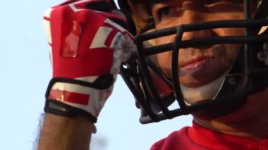 close-up footage of handsome man with baseball sports uniform and helmet