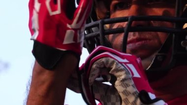 close-up footage of handsome man with baseball sports uniform and helmet