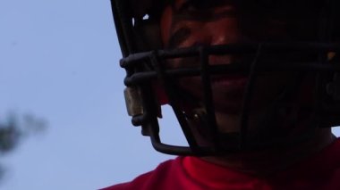 close-up footage of handsome man with baseball sports uniform and helmet