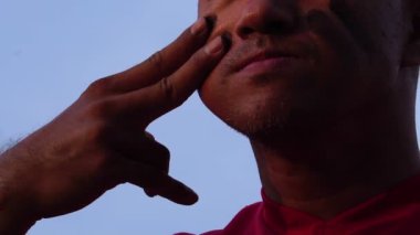 close-up footage of handsome man with baseball sports uniform and helmet