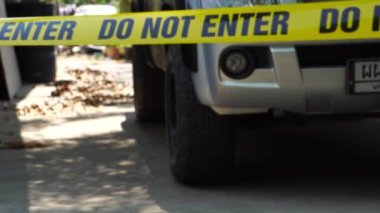 close-up footage of do not enter ribbon at place of crime