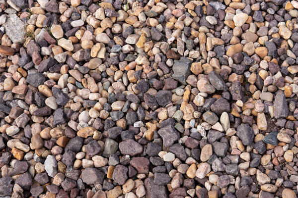Colored beach pebbles stones as background. Texture