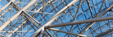 Panoramic image. Iron construction with glass. Roof of a modern building