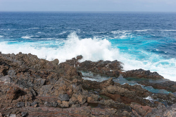 The Atlantic Ocean and rocky coast of in the north of Tenerife near Buenavista del Norte. Spain. Canary Islands