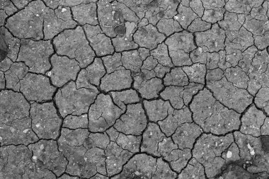 Siyah çatlak zemin. Kara kuru toprak arkaplanı