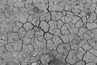 Siyah çatlak zemin. Kara kuru toprak arkaplanı