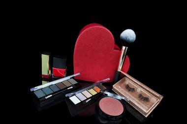 set of osmetics on background blush, eyeliner