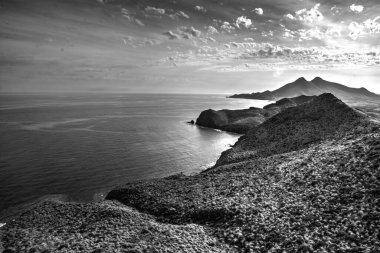 Black and white view of the Almeria coast. It is part of the Cabo de Gata Natural Park, Almeria, Spain.