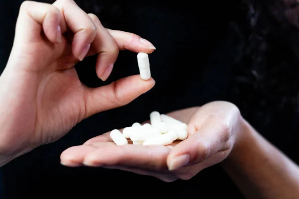 Hands holding pills, dispense medicine, healthy mental and physical life, medical treatment concept, replenish vitamins