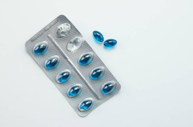 Blue pills for pain, dispensing medical pills, health and treatment