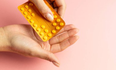 Hands squeezing pills, drug dispensing, health care, medicine help