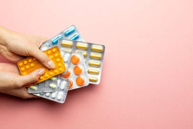 Packs with different pills and capsules, body support medicine, pain treatment, health care, pharmaceutical background