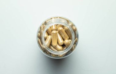 Ashwagandha pills with packaging on a white background, supplement, healthy organism, body protection