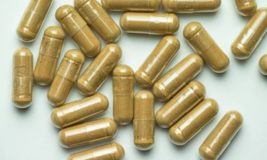 Ashwagandha capsules on a white background, tablets supporting immunity, supplementation of the body with essential ingredients