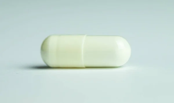 Zinc capsule on white background, dietary supplement