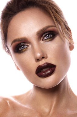 Beauty with creative cosmetics. Clean smooth bright skin. Full cherry lips, ideal eyebrows. Cosmetology and Spa salon. High-quality photo. Beauty portrait.