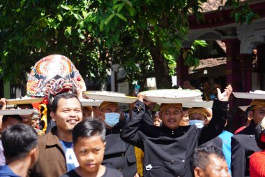 Javanese thanksgiving (Indonesian also call it Larung Semboyo, labuh laut, larung sesaji, sedekah laut). This thanksgiving held in sine beach