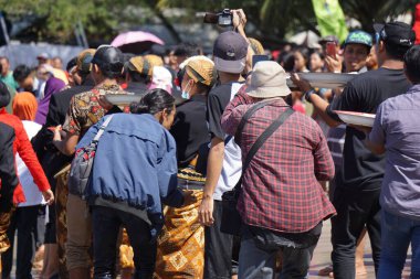 Javanese thanksgiving (Indonesian also call it Larung Semboyo, labuh laut, larung sesaji, sedekah laut). This thanksgiving held in sine beach