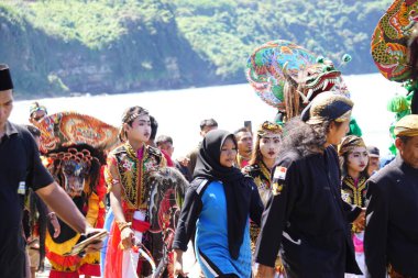 Javanese thanksgiving (Indonesian also call it Larung Semboyo, labuh laut, larung sesaji, sedekah laut). This thanksgiving held in sine beach