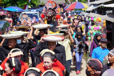 Javanese thanksgiving (Indonesian also call it Larung Semboyo, labuh laut, larung sesaji, sedekah laut). This thanksgiving held in sine beach