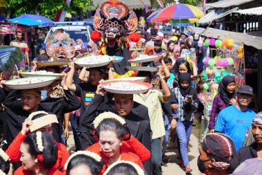 Javanese thanksgiving (Indonesian also call it Larung Semboyo, labuh laut, larung sesaji, sedekah laut). This thanksgiving held in sine beach