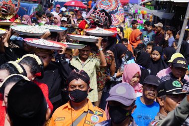 Javanese thanksgiving (Indonesian also call it Larung Semboyo, labuh laut, larung sesaji, sedekah laut). This thanksgiving held in sine beach
