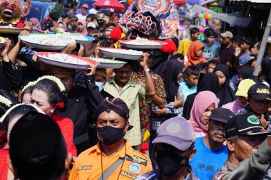 Javanese thanksgiving (Indonesian also call it Larung Semboyo, labuh laut, larung sesaji, sedekah laut). This thanksgiving held in sine beach