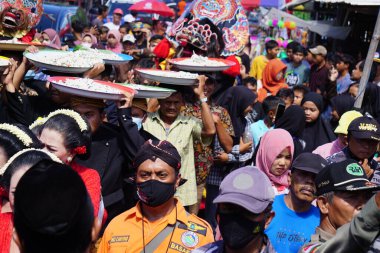 Javanese thanksgiving (Indonesian also call it Larung Semboyo, labuh laut, larung sesaji, sedekah laut). This thanksgiving held in sine beach
