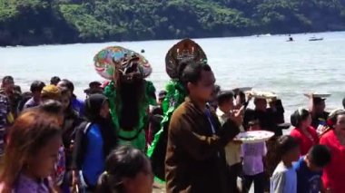 Javanese thanksgiving (Indonesian also call it Larung Semboyo, labuh laut, larung sesaji, sedekah laut). This thanksgiving held in sine beach