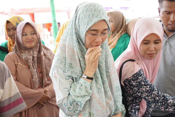 stock image Anggia Erma Rini (members of the House of Representatives or DPR RI) is eating durian on sumberasri durian festival