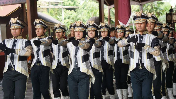Indonesian senior high school students with uniforms in marching.