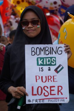 Bazı Endonezyalılar arabasız bir günde özgür bir Filistin istiyor.