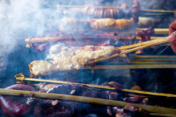 Baking and grilling marinated fish on a barbecue grill (grilled fish). Fish grilled over charcoal