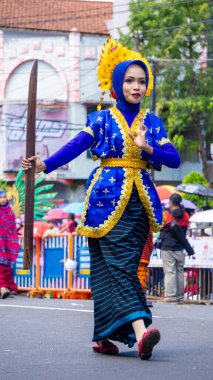 The Lupe dance comes from Bima (Nusa Tenggara Barat) on 3rd BEN Carnival. Lupe is an umbrella made from mountain pandan leaves clipart