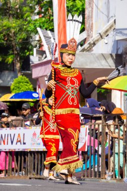 Gantar dance from East Borneo. This dance symbolizes the joy and hospitality of the Dayak tribe in welcoming guests clipart