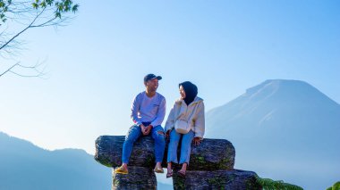 People vacation on Taman Langit Dieng, one of the famous tourist destinations in Wonosobo. clipart