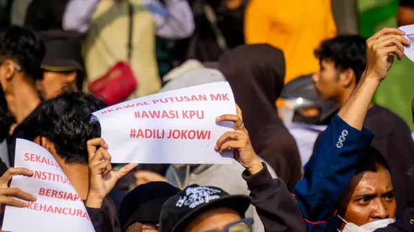 stock image Students demonstrate by carrying signs that mean they reject dynasty politics and changes to the election law.