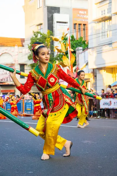 stock image Bulouh dance from Bangka Belitung on the 3rd BEN Carnival. Bulouh Dance depicts the beauty and strength of bamboo which is part of people's lives.